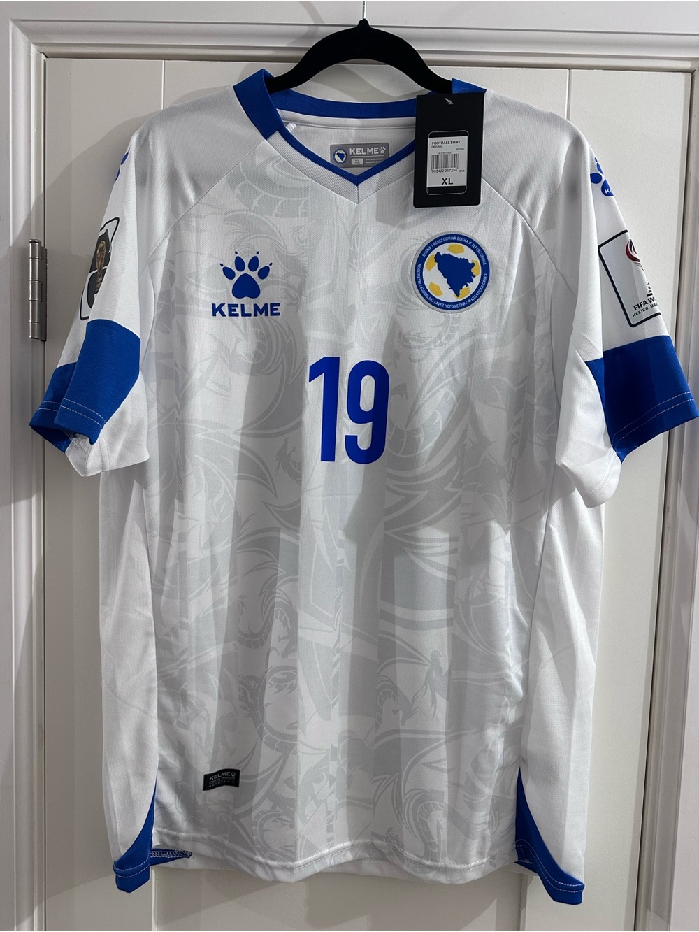 Kelme Men’s White and Blue Football Jersey - Number 19